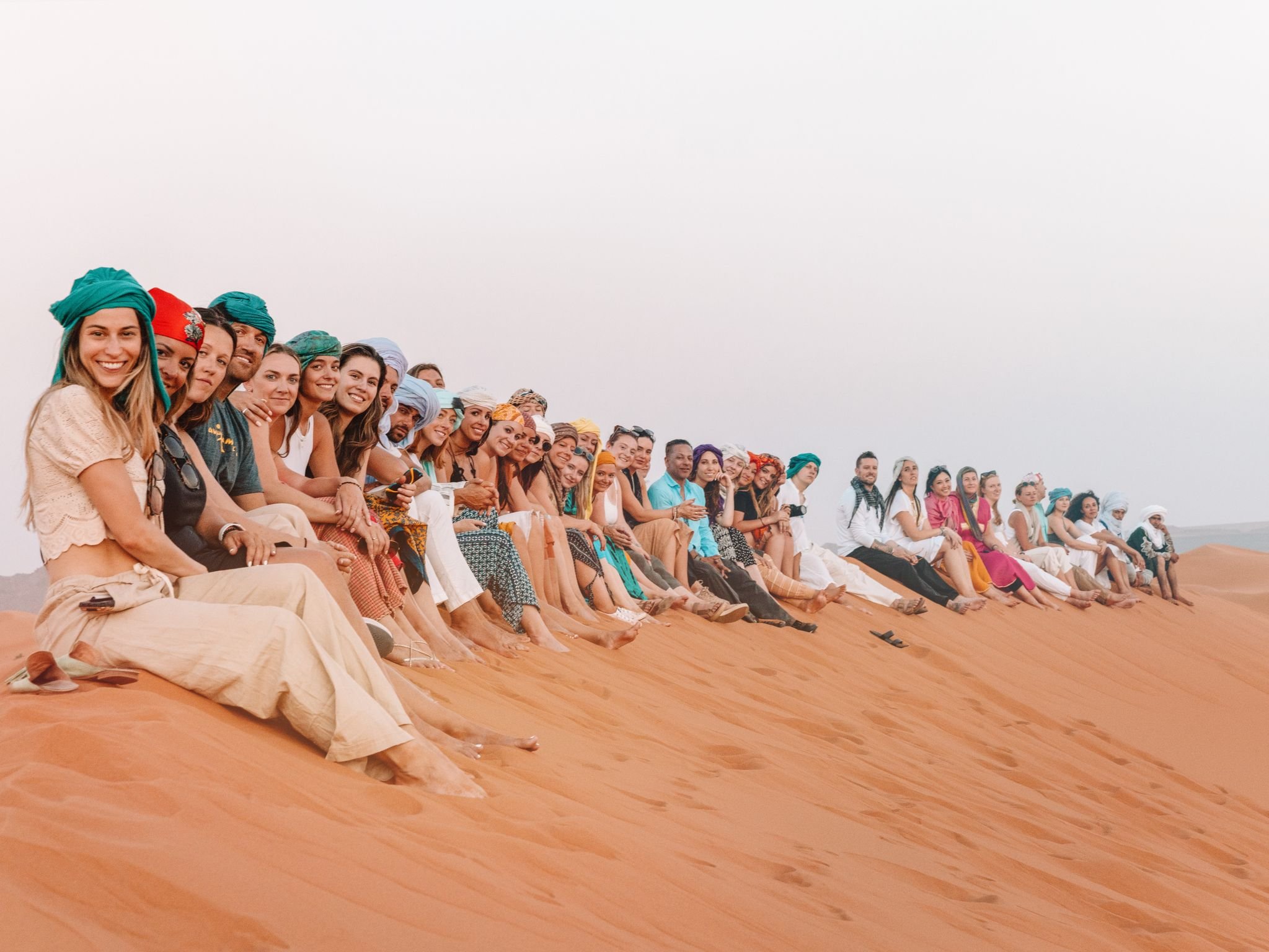 SurfYogaBeer guests on the Sahara dunes in Morocco